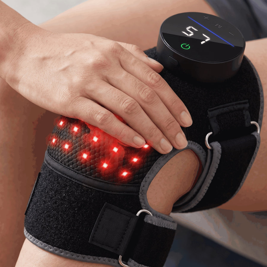 Hand resting on the Bellrose knee wrap during a massage